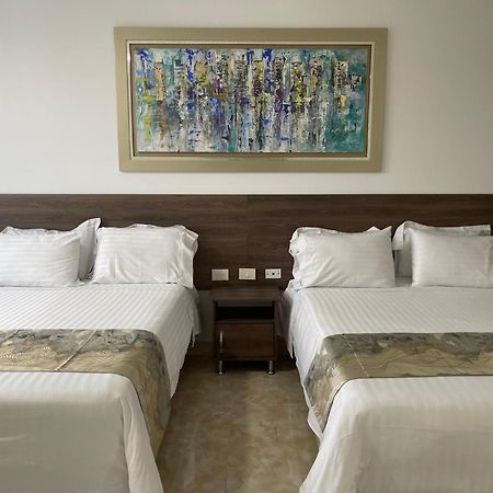 Hotel Royal Elim International Cali Kültér fotó A room at the hotel