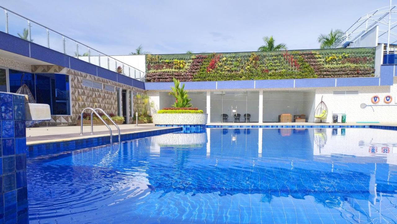 Hotel Royal Elim International Cali Kültér fotó The swimming pool at the hotel