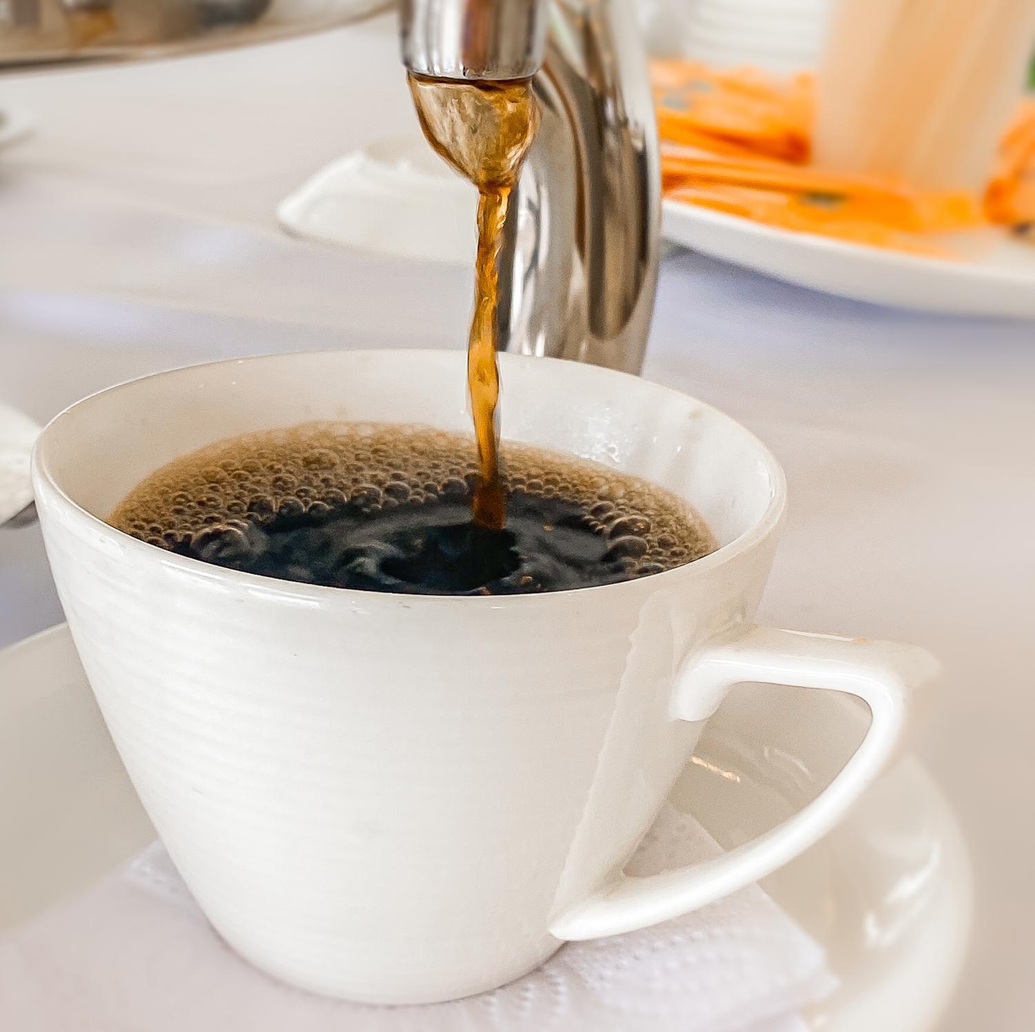 Hotel Royal Elim International Cali Kültér fotó Coffee being poured