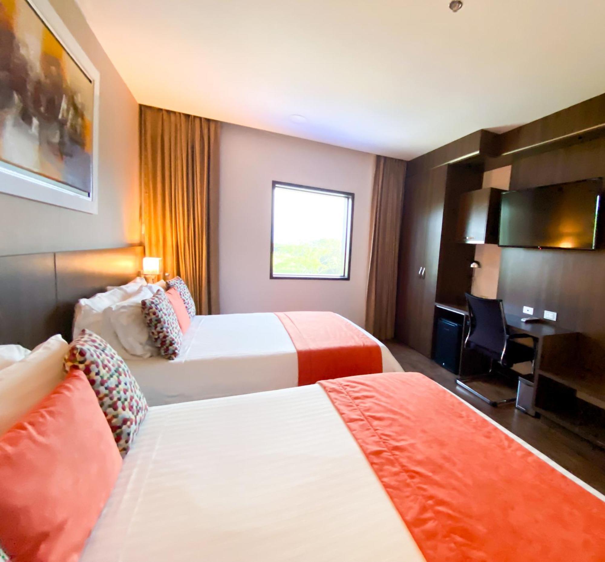 Hotel Royal Elim International Cali Kültér fotó A room at the hotel