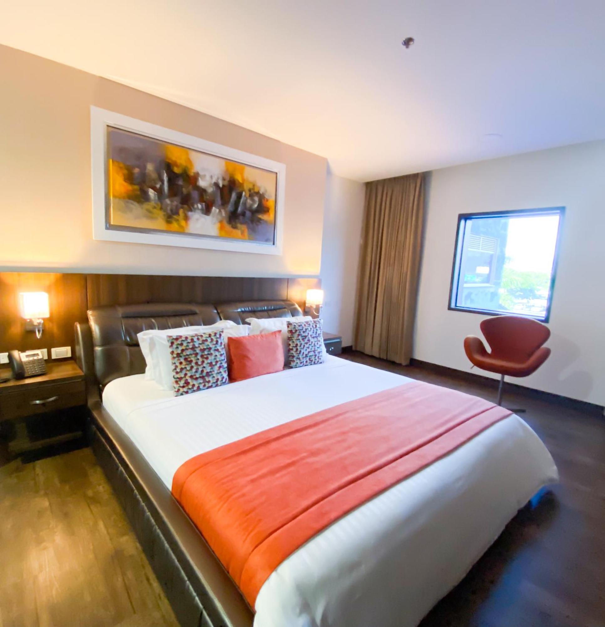 Hotel Royal Elim International Cali Kültér fotó A bedroom at the hotel