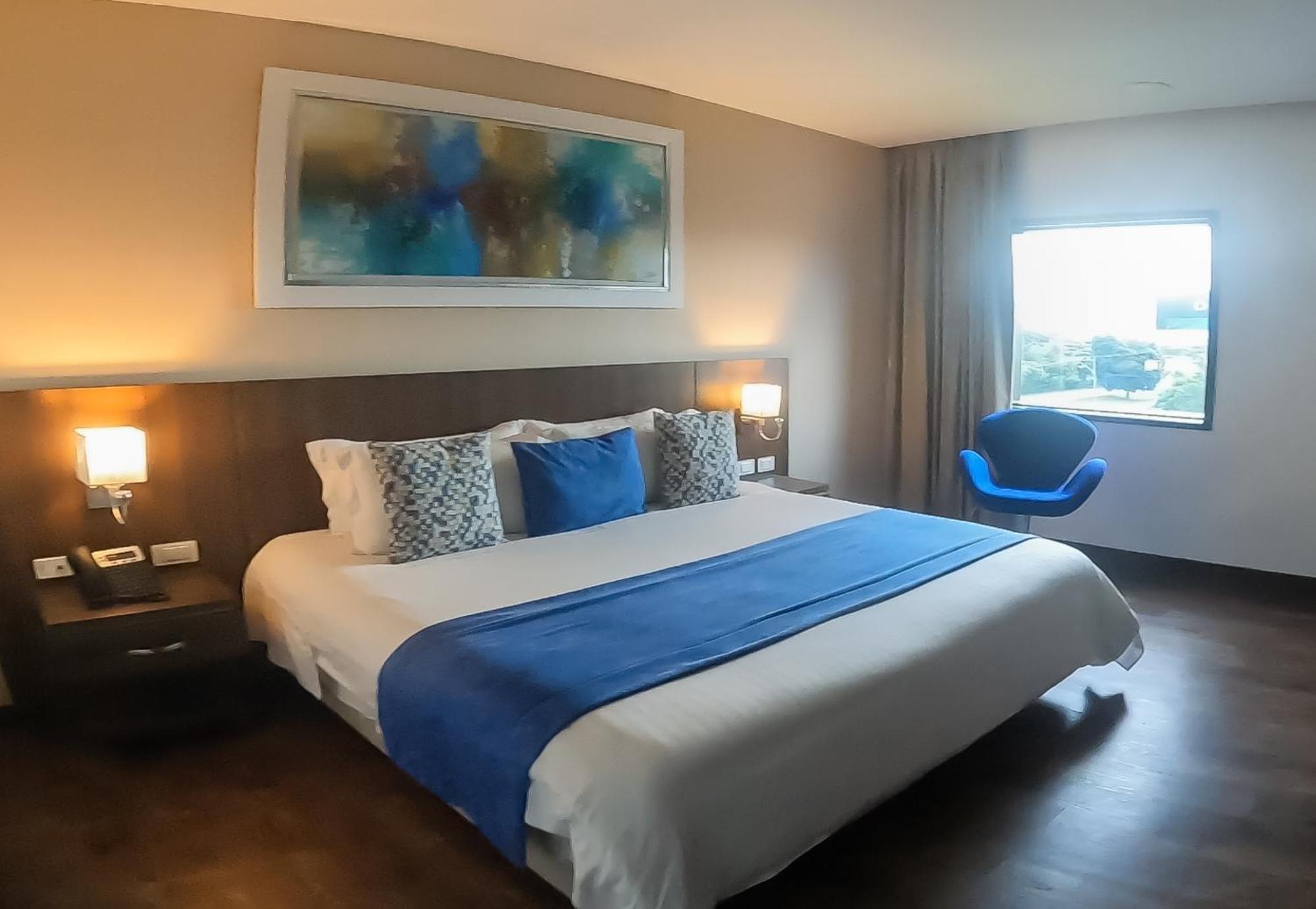 Hotel Royal Elim International Cali Kültér fotó A room at the hotel