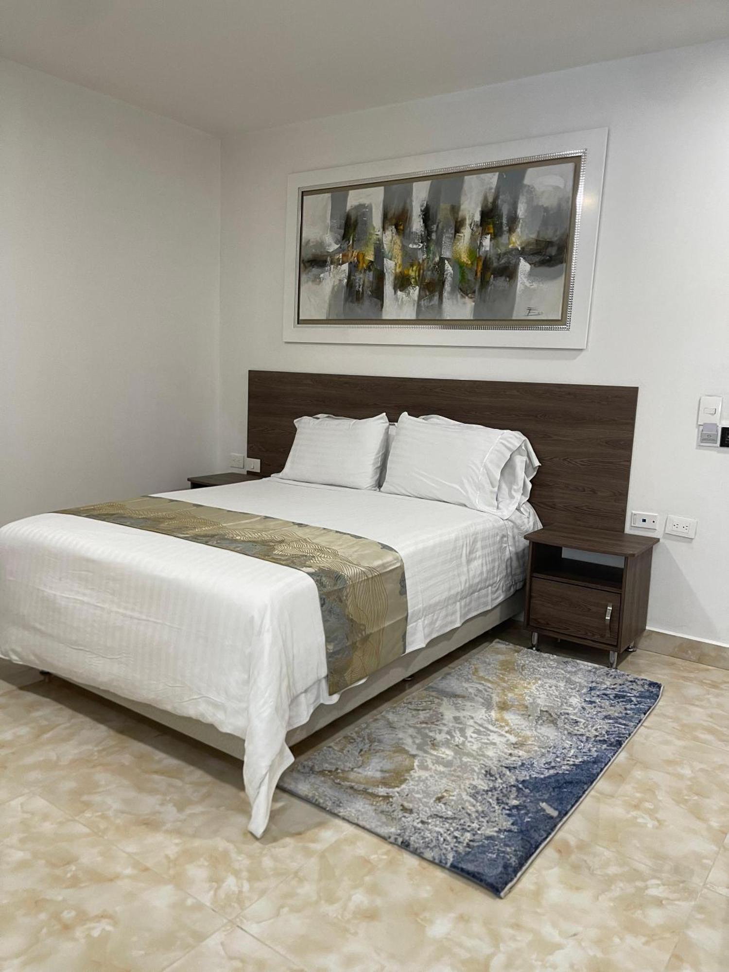 Hotel Royal Elim International Cali Kültér fotó A bedroom at the hotel